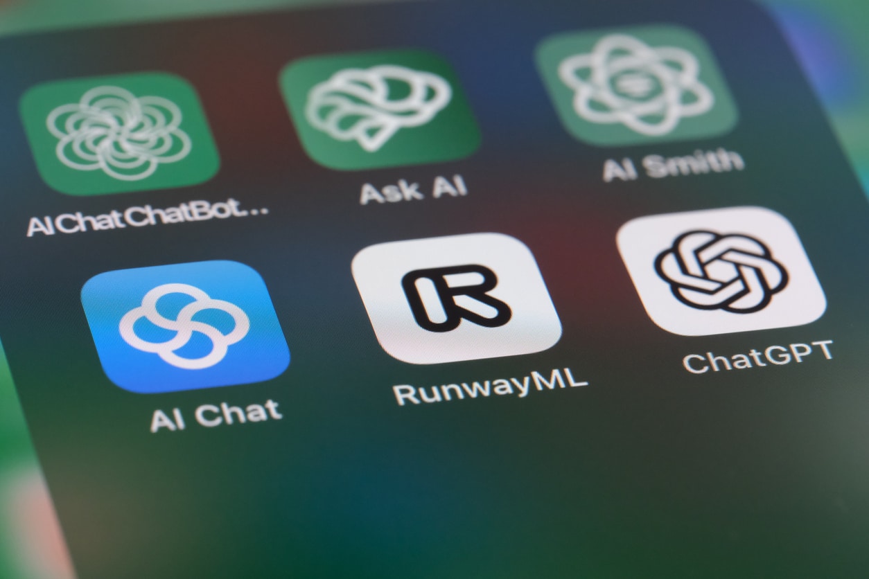 Six blue, green, & white app icons for AI software are arranged in a grid on a mobile device