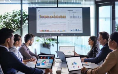 a focused digital marketing team collaborates in a modern office environment, clustered around a sleek conference table with laptops open and dynamic charts on the screen, illustrating the complexities and strategies of launching a ppc advertising campaign.